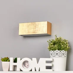 Lindby LED-seinävalaisin Quentin, 23cm leveä, kullanvärinen, metallia
