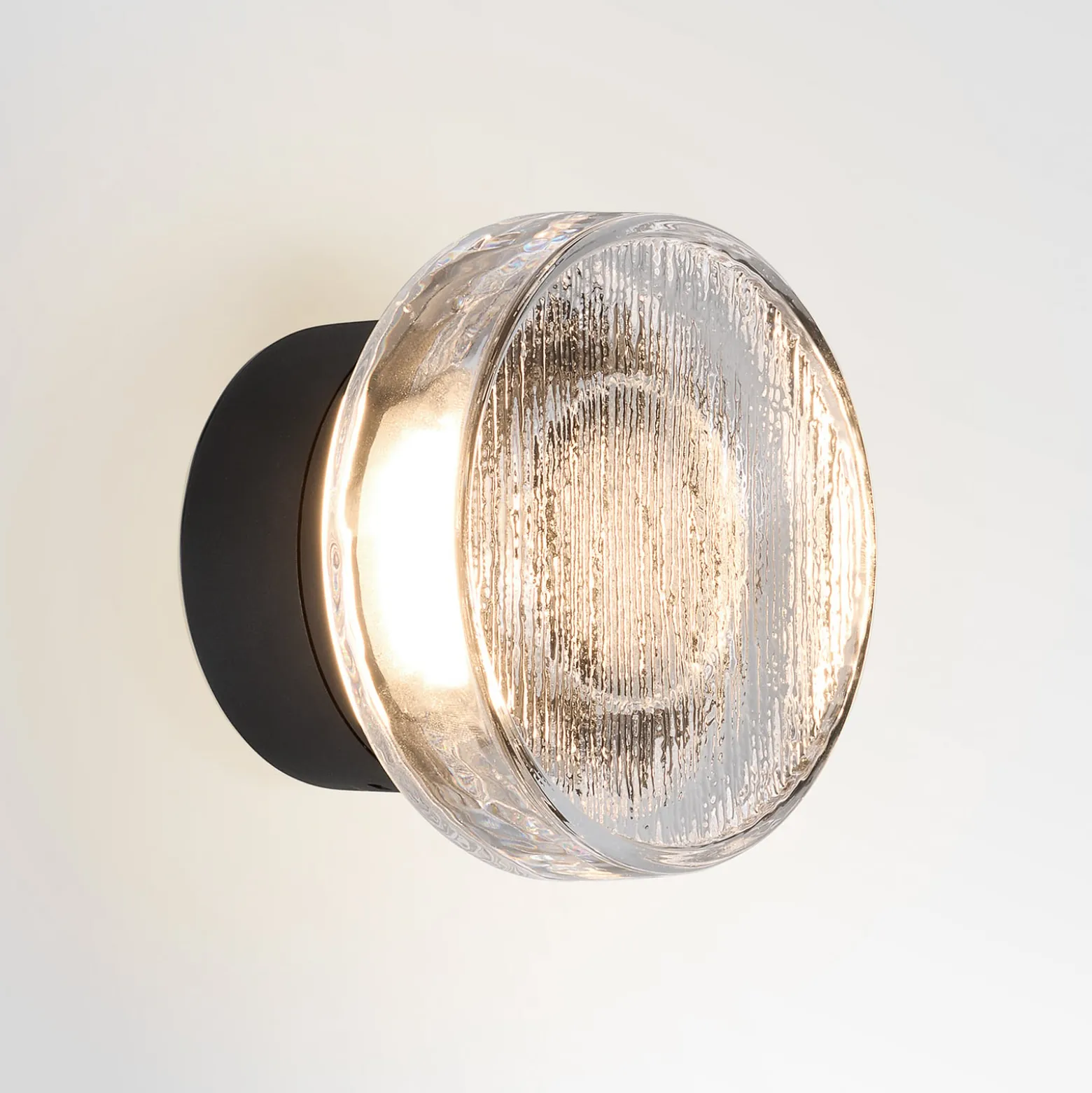 MARSET LED-ulkoseinälamppu Roc, Ø 14 cm, musta/läpikuultava