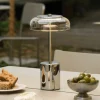 Nuura LED-akkukäyttöinen pöytälamppu Blossi, korkeus 26 cm, kromi/kirkas